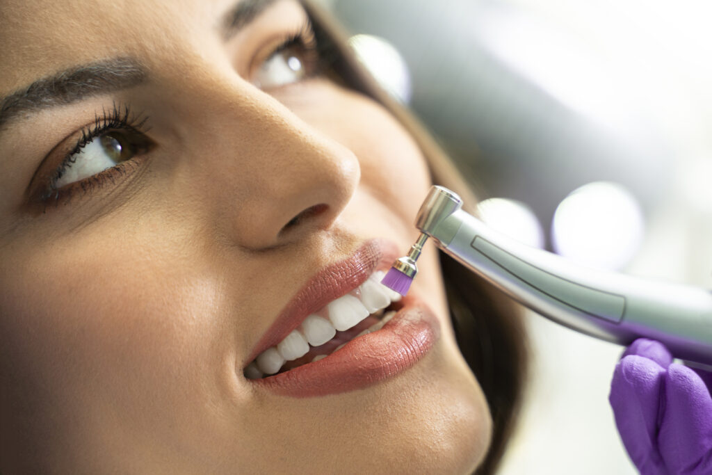 young woman getting her teeth polished
